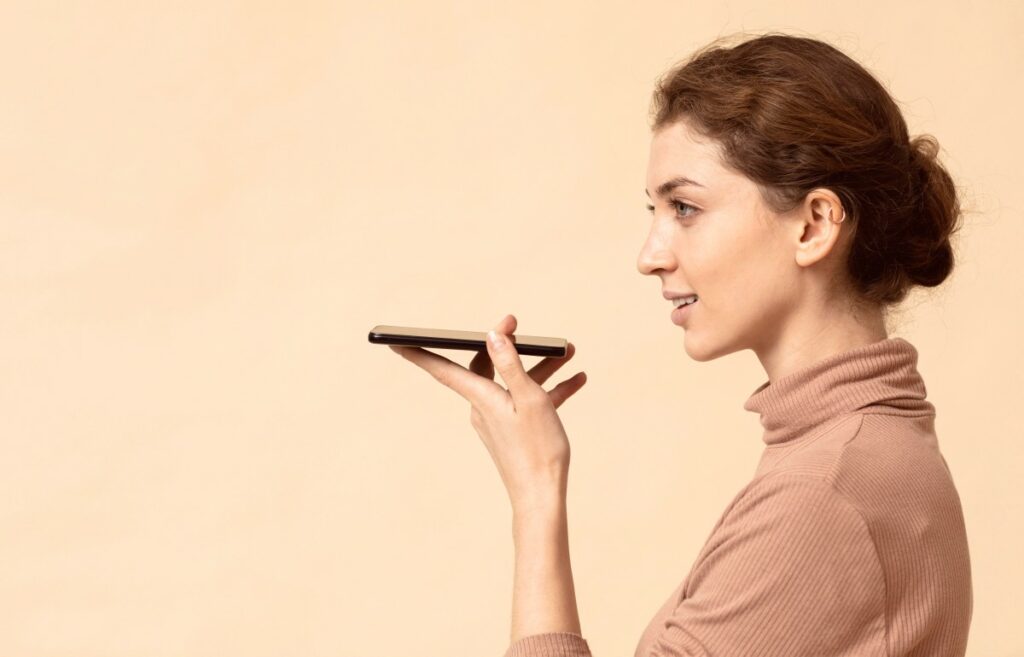woman talking mobile phone speaker