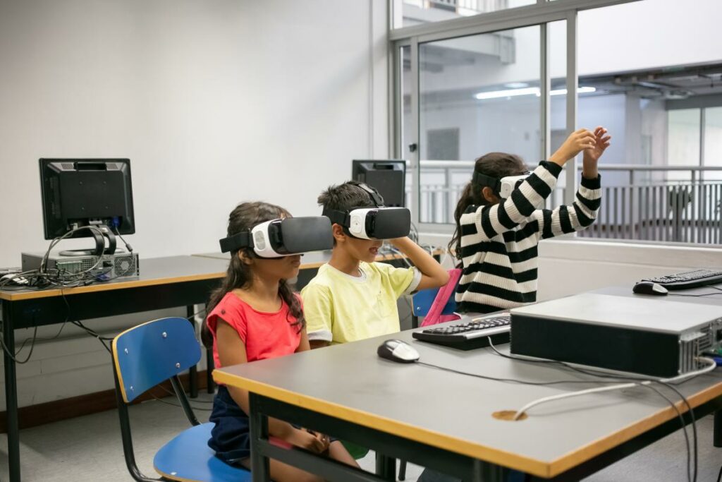 cute multiethnic kids learning use virtual reality glasses